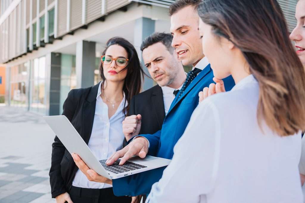 Business professionals reviewing SAP SuccessFactors integration data on a laptop screen